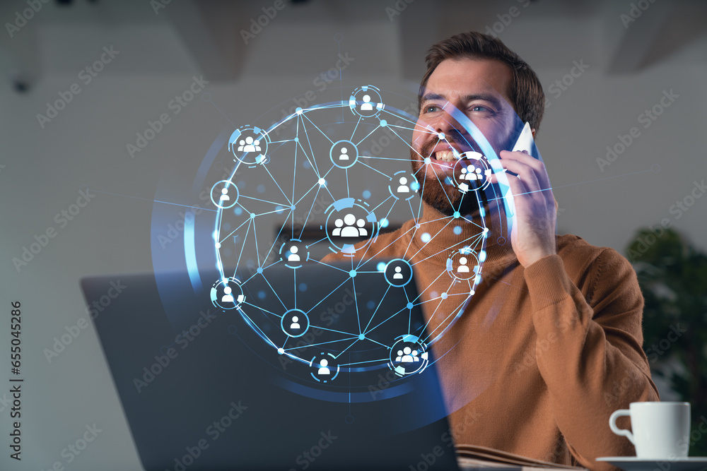 Poster handsome businessman working on laptop at office workplace in background. using phone to read text, 