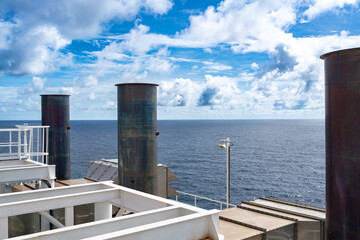 Smoke stacks from offshore gas and oil drilling rigs in the petroleum industry.