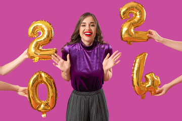 Young woman and hands with balloons in shape of figure 2024 on purple background. New Year celebration
