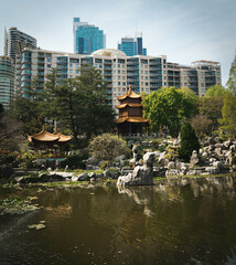 Chinese garden with city in background