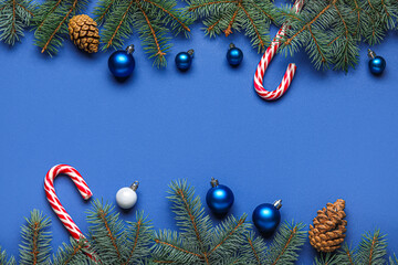 Composition with beautiful Christmas balls, cones and fir branches on color background © Pixel-Shot