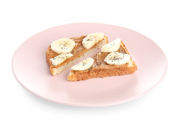 Plate of cut toast with peanut butter and banana on white background