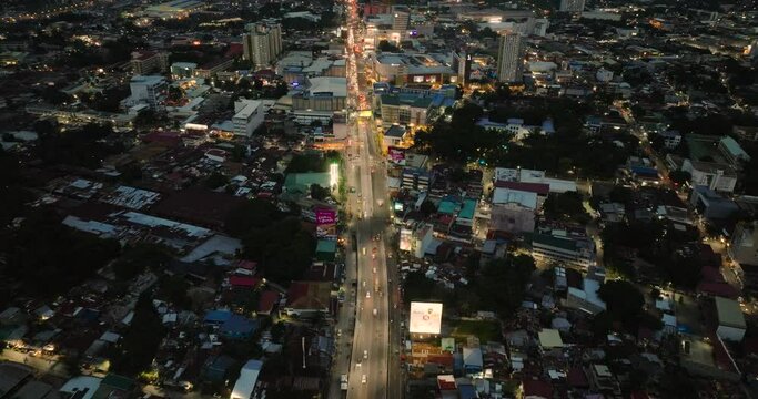 Cagayan de Oro city with busy highway with street light and vehicles. Mindanao, Philippines. Cityscape.