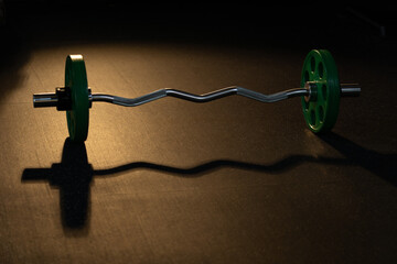 barbell and weight plates for practicing routine weightlifting in gym, fitness equipment workout...