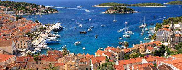 Panoramic aerial view of harbor of Hvar with Adriatic Sea and boats, Croatia