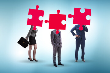 Concept of business people and jigsaw puzzle