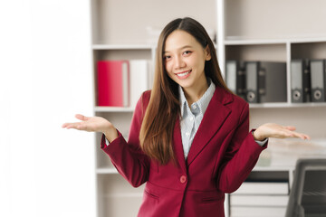 Asian people independent investment consultant captured in her element at office, donning vibrant...
