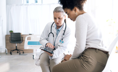 Doctor, women and tablet in medical consultation, hospital meeting and talking of online results,...