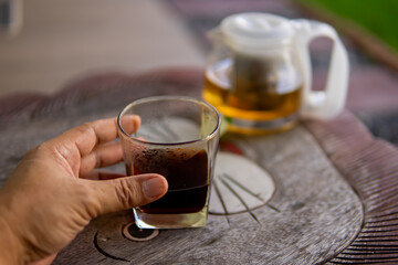 Close up hand dripping coffee