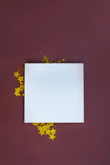 White canvas backdrop and shining glitter. Glittering sparkle backdrop. Mock up white canvas and golden glitter stars