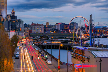 Seattle waterfront skyline and the Puget Sound at sunset in Seattle, Washington - obrazy, fototapety, plakaty