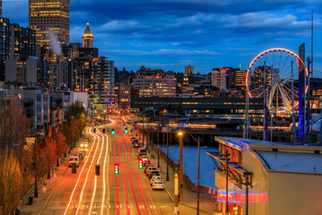 Seattle waterfront skyline and the Puget Sound at sunset in Seattle, Washington