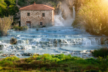 Empty natural spa with turquoise water at Saturnia thermal baths, in Tuscany, Italy. Le Cascate del Mulino is a perfect place to relax in waterfalls and hot springs. - 655102613