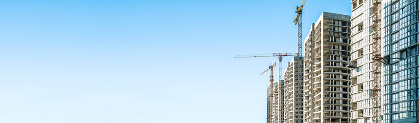 Fototapeta na wymiar Construction Building site banner background. Construction crane with new apartment skyscraper building. Building industry technology, business, urban concept