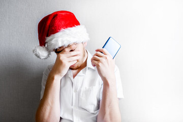 Sad Young Man in Santa Hat