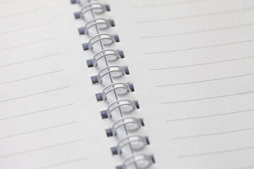 Business concept - Top view of white spiral notebook on white.