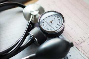Stethoscope and medical documents. Selective focus. Blue tone image. Medical and healthcare concept.