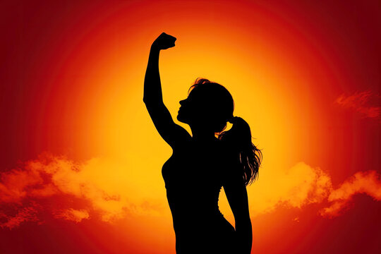 woman raising fist into sky as female empowerment, feminism and women's rights concept