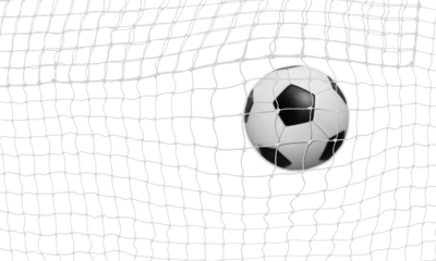 The soccer ball goes into the net and scores a goal. PNG transparent