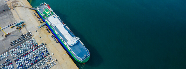 Aerial view Ro-Ro Ship of business logistic sea freight, New Cars produced by year up in the port...