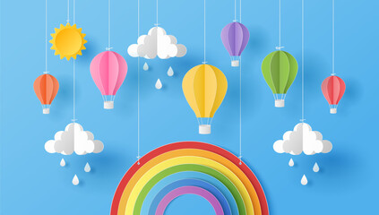 Paper cut style of sun, clouds, rain drops and hot air balloons with rainbow on blue sky. Summer background.  Vector illustration