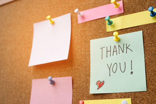 collection of colorful variety post it. paper note reminder sticky notes pin paper blue  on cork bulletin board. empty space for text.