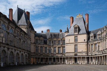 Fototapeta na wymiar Exterior architecture of the Château de Fontainebleau in France