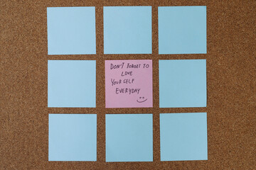 collection of colorful variety post it. paper note reminder sticky notes pin paper blue  on cork...