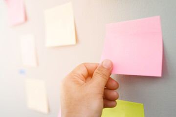 collection of colorful variety post it. paper note reminder sticky notes pin paper blue  on cork...