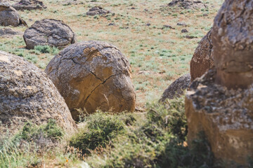 Unusual spherical shape of stones in the Kazakh steppe Mangistau, valley of balls in nature Torysh
