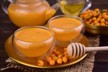 Tea made from sea buckthorn berries. The concept of autumn drinks.
