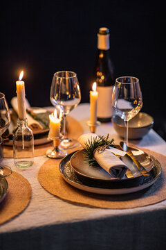 Winter Holidays, Dinner Party And Celebration Concept - Close Up Of Scandinavian Christmas Table Serving With Burning Candles At Home At Night