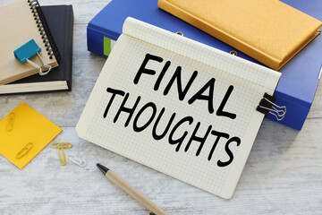 Final thoughts. Conclusion business concept. Text written on note paper in a notepad on a wooden background. blue folder