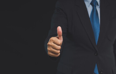 Businessman gives the client satisfaction thumbs up for the best excellent services.