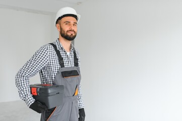 Portrait of a builder on a construction site indoors