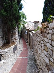 view of the narrow streets and stone houses of eze village in the french riviera, France 