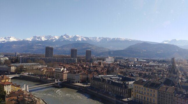 High angle view of river amidst buildings in city of Grenoble, France 