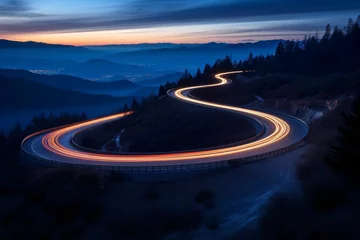 Fototapeten an electric car's silhouette, motion-blurred as it glides along a serpentine mountain path at dusk. The remaining sunlight casts a soft glow on the roadway © Christian