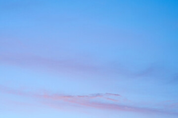 The cloudscape in the evening sky was a canvas of pink and blue