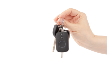 car alarm remote control and car key in hand isolated, vehicle security system, theft protection