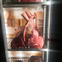 Tomahawk steak in refrigerator at restaurant