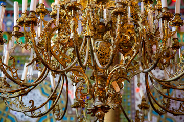 A scene taken inside an ancient building where hanging lights were in use at the time