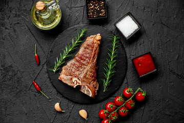Grilled T-bone steak on stone background