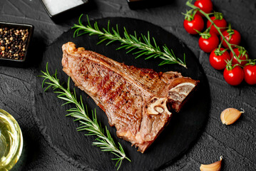 Grilled T-bone steak on stone background