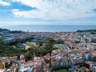 Obraz premium Resort town on the Mediterranean coast in Spain. Drone view of the city of Lloret De Mar.