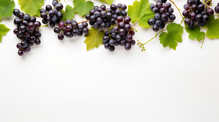 Green and Black juicy grapes on white background. autumn Frame made of grapes. Copy space for text or menu on white wooden background. Fruit berry Frame Border Long web banner