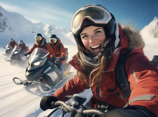 Fotobehang A group of people on snowmobiles © cherezoff