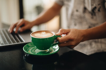 Drink hot coffee in a green mug