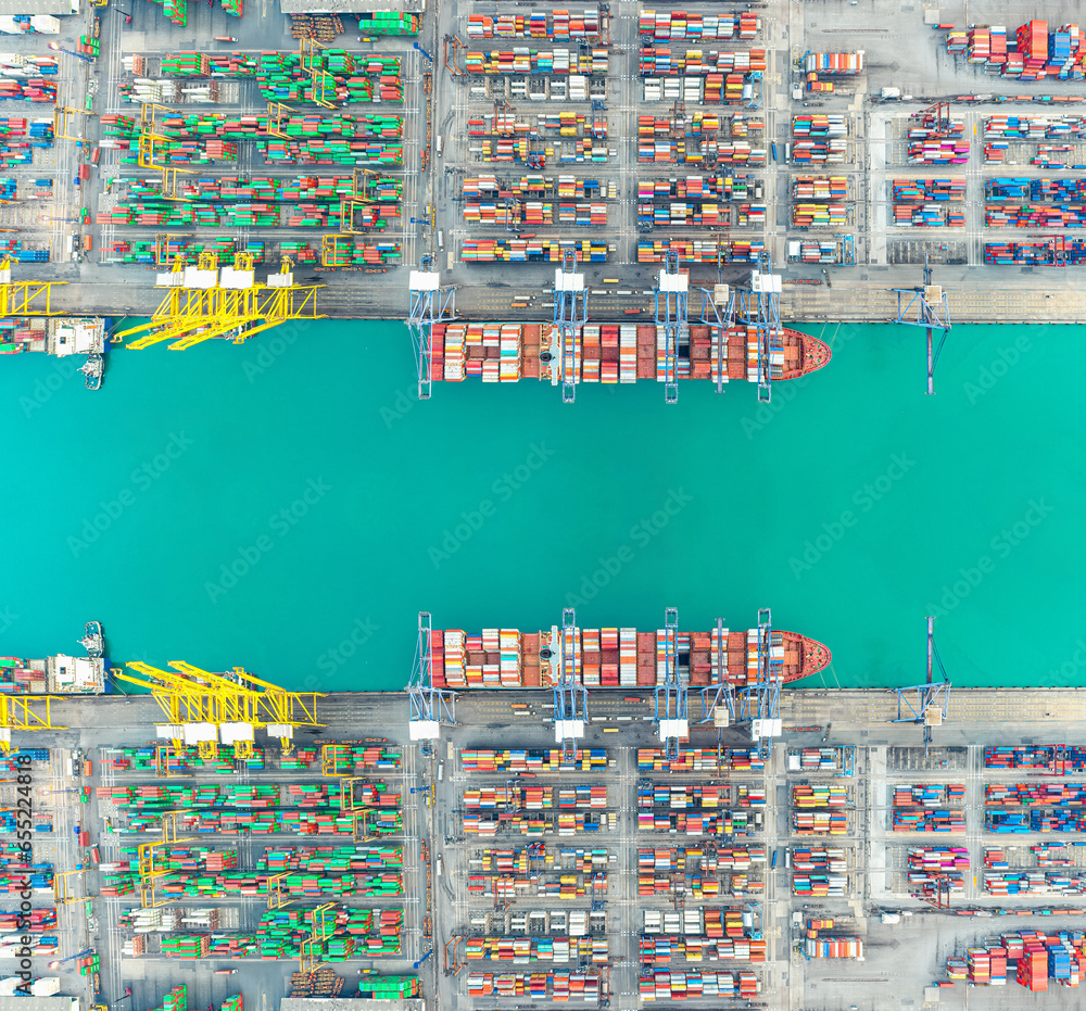 Wall mural Aerial top view of Container ship loading and unloading, Cargo container in deep seaport for the international order concept. - Wall murals