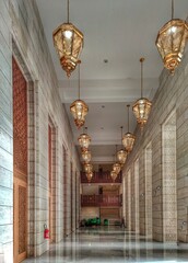 the corridors of the great mosque of Algiers, the giant wooden doors and the golden chandeliers